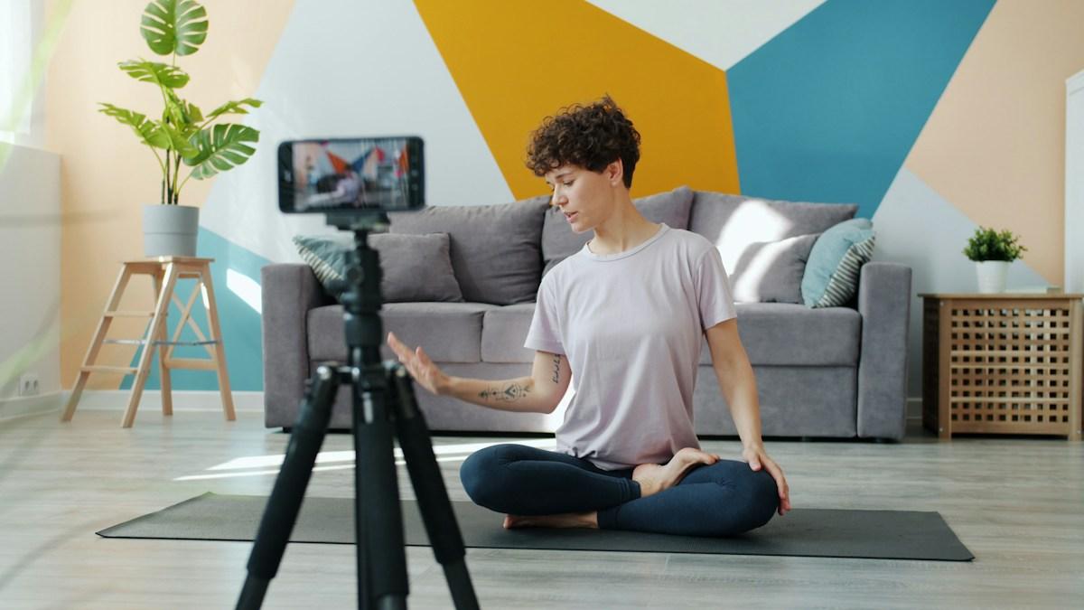 Creator recording a video on a phone tripod