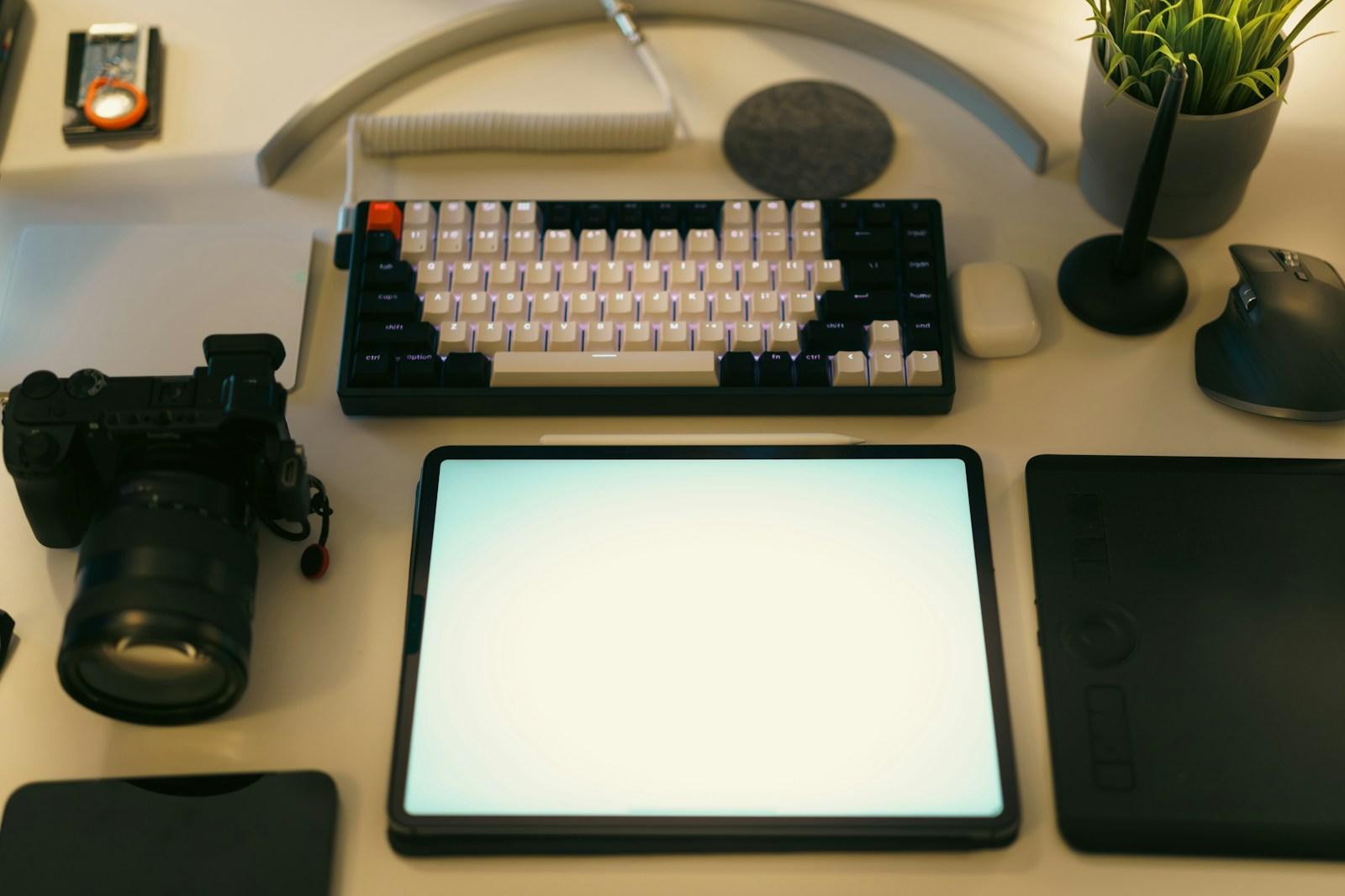 Desk setup with camera and tablet for making videos